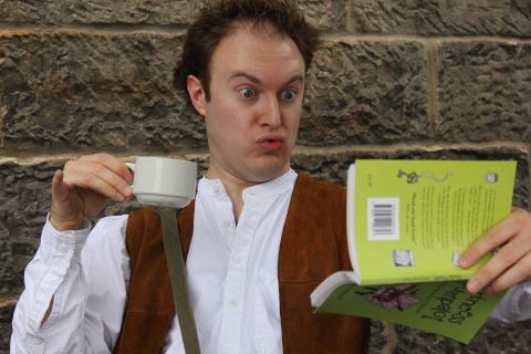 Guffy reading upside down book